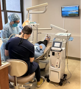 Dr. Cohen performing LANAP laser surgery on a patient with the PerioLase MVP-7 machine at Sachar Dental NYC