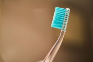 Close-up of a toothbrush, emphasizing the need to replace your toothbrush regularly for optimal oral health.