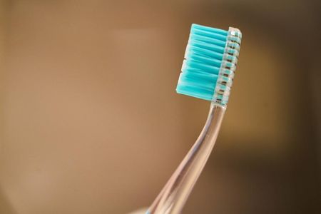 Close-up of a toothbrush, emphasizing the need to replace your toothbrush regularly for optimal oral health.